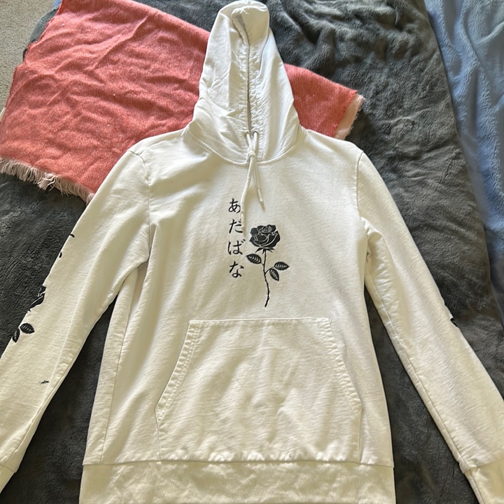 Worn twice. white hoodie with black rose and black lettering.
